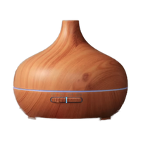 Ultrasonic essential oil diffuser in a light wood grain finish
